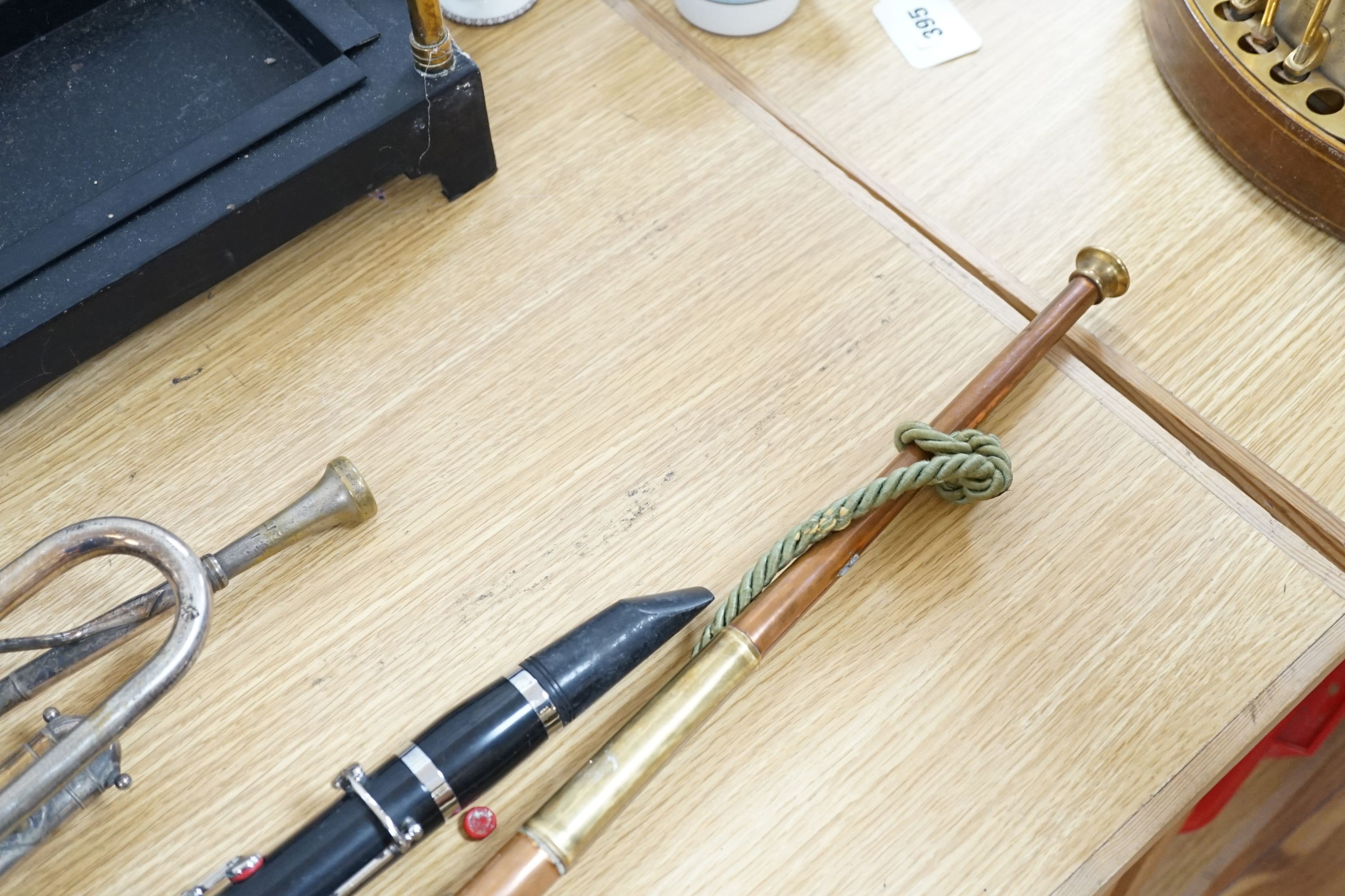 A Boosey and co Clarinet H.75983, plated trumpet, brass bugle and a copper hunting horn 87cm